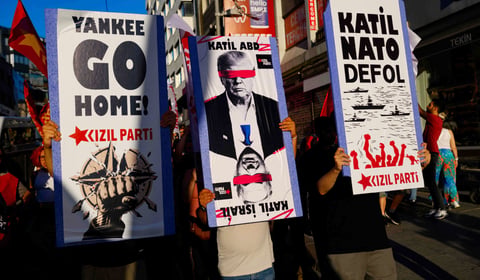 Protesters wave flags during anti-NATO demonstration in Istanbul ahead of Ankara summit July 2026