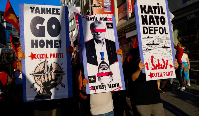 Protesters wave flags during anti-NATO demonstration in Istanbul ahead of Ankara summit July 2026