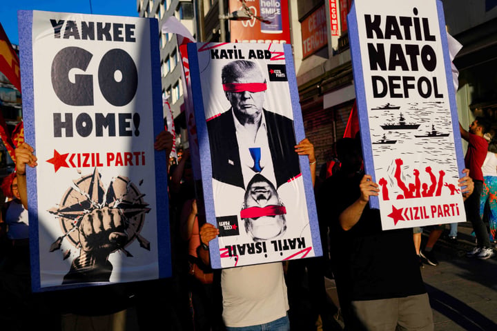 Protesters wave flags during anti-NATO demonstration in Istanbul ahead of Ankara summit July 2026
