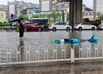 Emergency workers and evacuees during Typhoon Bavi flooding in northeast China