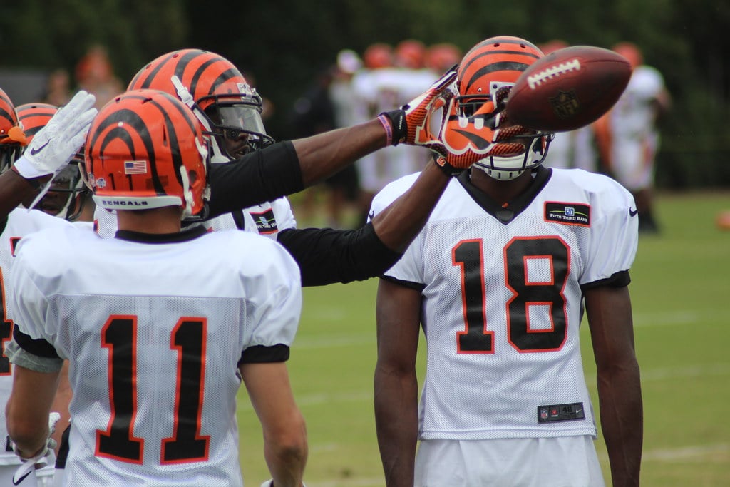 NFL wide receiver running a route drill at training