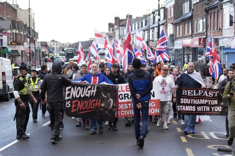Far-right protesters holding banners in Southampton, UK, ahead of counter-terrorism arrests targeting an Ijtima Muslim festival plot