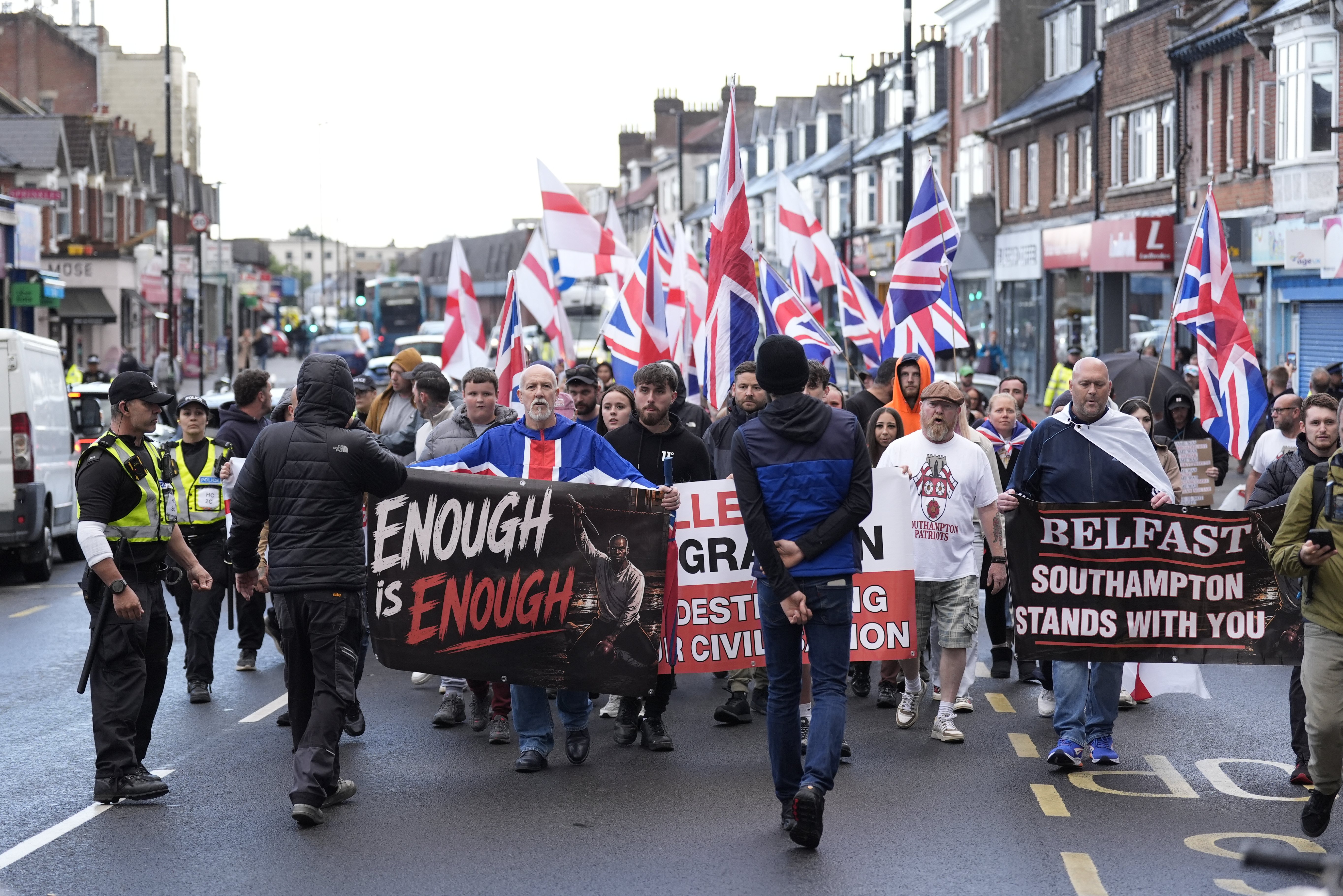 Far-right protesters holding banners in Southampton, UK, ahead of counter-terrorism arrests targeting an Ijtima Muslim festival plot