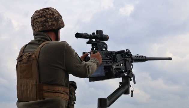 Ukrainian air defense units repelling a Russian drone and missile assault over Ukraine