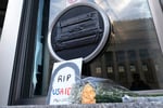 Flowers and signs outside the USAID headquarters in Washington on February 7, 2025, after the Trump administration began dismantling the agency