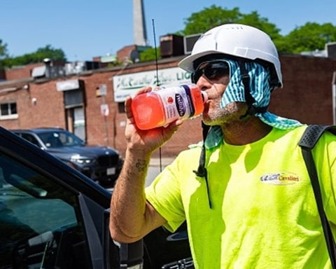 A construction worker takes a water break during the extreme heat wave in Boston July 2026