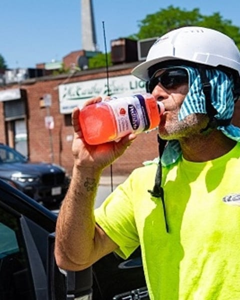 A construction worker takes a water break during the extreme heat wave in Boston July 2026