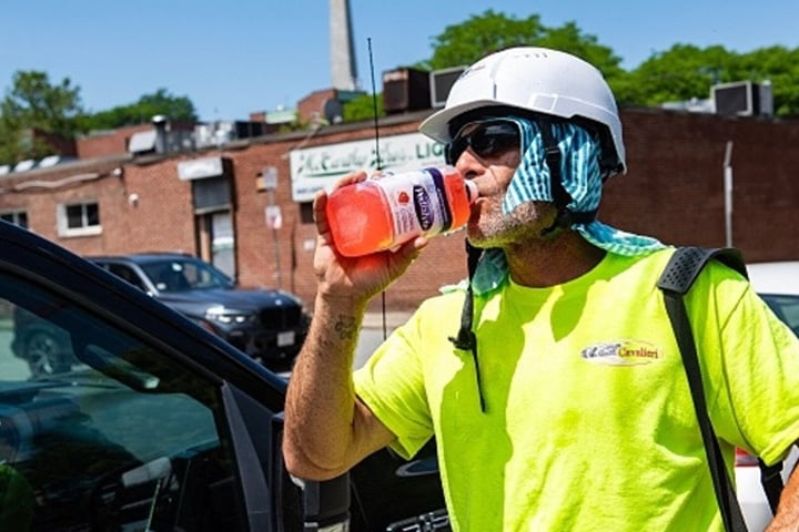 A construction worker takes a water break during the extreme heat wave in Boston July 2026