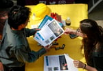 Job seekers and employers at a hiring fair in the United States, June 2026