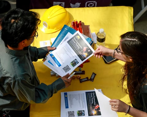 Job seekers and employers at a hiring fair in the United States, June 2026