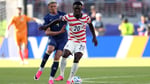 Folarin Balogun of the United States is challenged during the FIFA World Cup 2026 Round of 32 match against Bosnia and Herzegovina in Santa Clara
