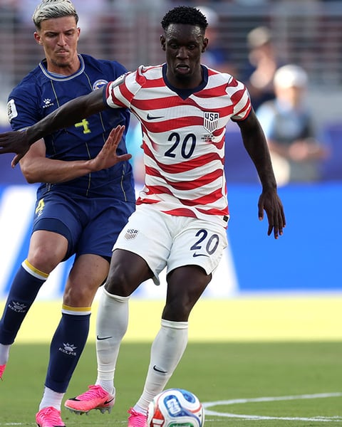 Folarin Balogun of the United States is challenged during the FIFA World Cup 2026 Round of 32 match against Bosnia and Herzegovina in Santa Clara