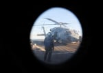 US Navy guided-missile destroyer USS Roosevelt and an HSM-79 helicopter conduct a Strait of Hormuz transit