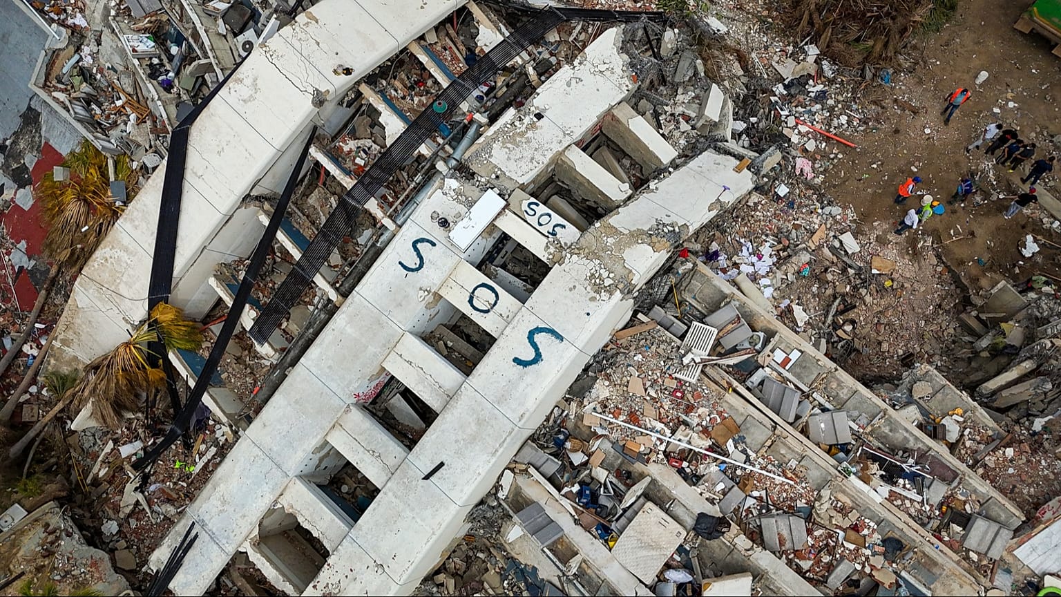 Rescue workers at Venezuela earthquake disaster site following the June 24 twin earthquakes in La Guaira