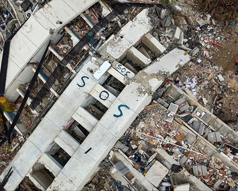 Rescue workers at Venezuela earthquake disaster site following the June 24 twin earthquakes in La Guaira