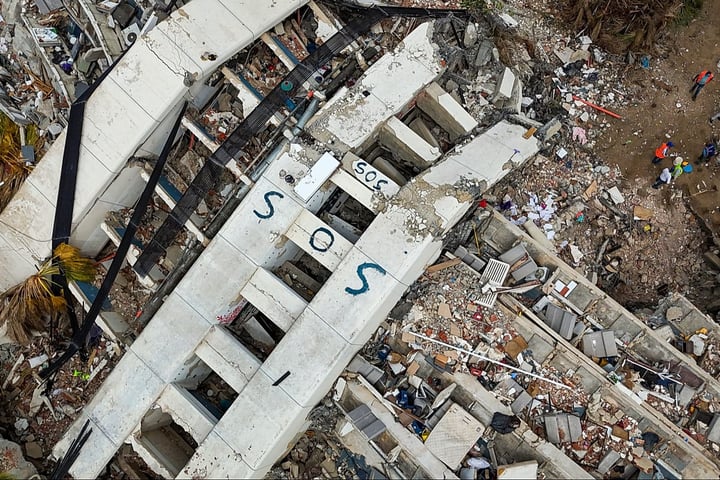 Rescue workers at Venezuela earthquake disaster site following the June 24 twin earthquakes in La Guaira