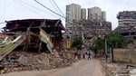 Rescue workers search through earthquake rubble in La Guaira Venezuela