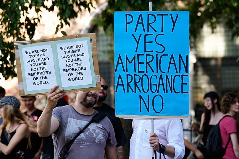 Police line at Venice's St Mark's Basin as protesters challenge Trump's ambassador Fertitta arriving on his $450m superyacht Boardwalk in July 2026