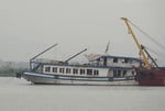 The Wonder Sea tourist boat being towed to a shipyard after capsizing in Ha Long Bay, Vietnam, in July 2025
