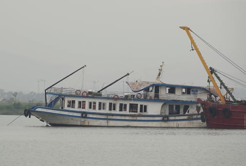 The Wonder Sea tourist boat being towed to a shipyard after capsizing in Ha Long Bay, Vietnam, in July 2025