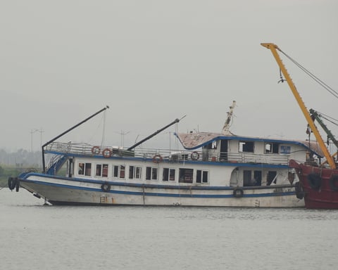 The Wonder Sea tourist boat being towed to a shipyard after capsizing in Ha Long Bay, Vietnam, in July 2025