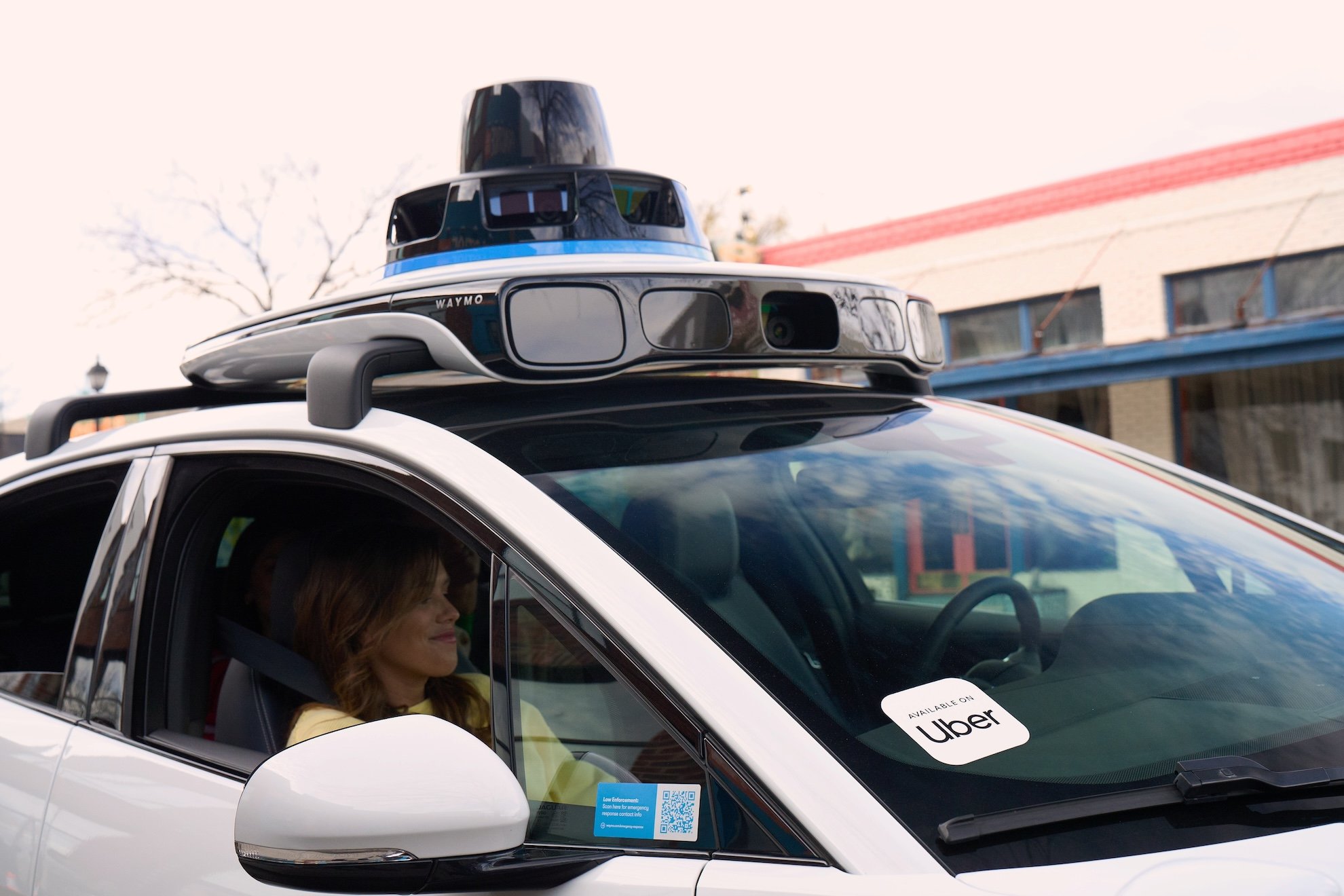 Waymo and Uber partnership branding for autonomous ride-hailing service