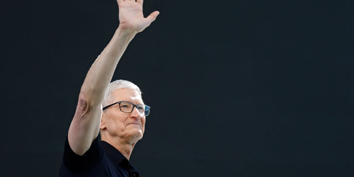 AAPL stock today: Apple chief executive Tim Cook waves to an audience in Cupertino, California, before handing over to John Ternus