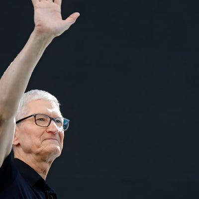 AAPL stock today: Apple chief executive Tim Cook waves to an audience in Cupertino, California, before handing over to John Ternus