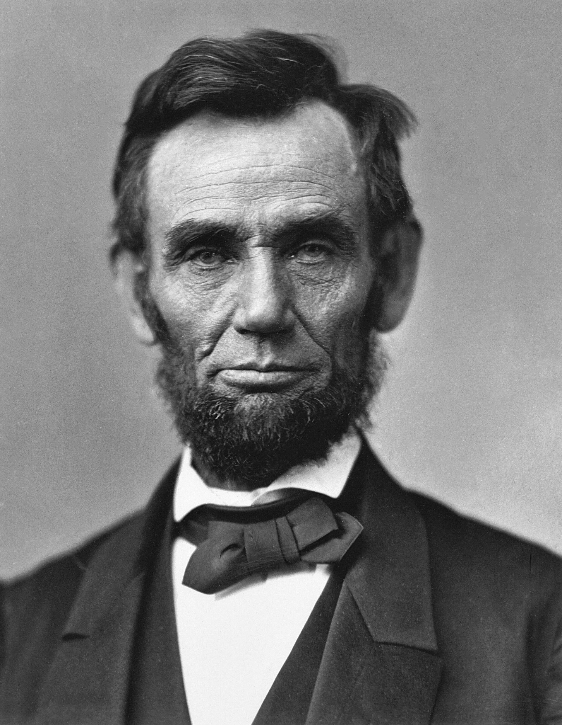 Abraham Lincoln photographed in February 1865, visibly gaunt and lined after four years of civil war