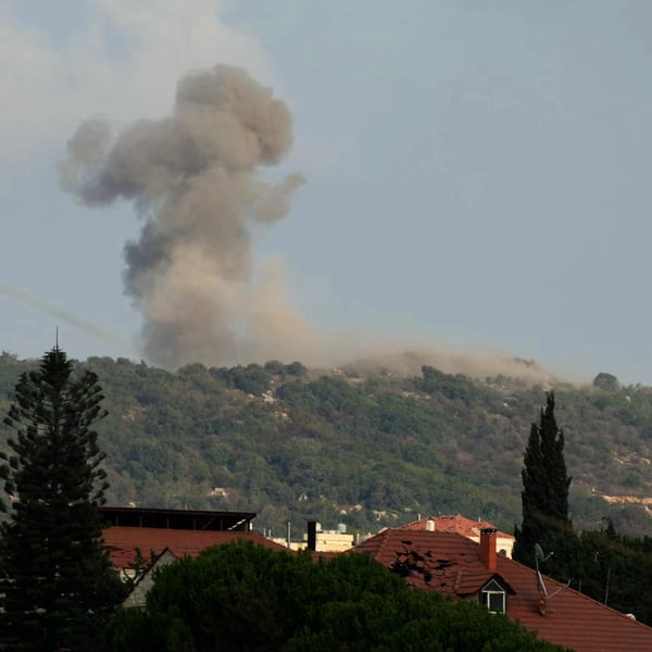 Smoke rises from the site of Israeli strikes on the strategic Ali al-Taher Ridge, seen from the southern Lebanese area of Nabatieh