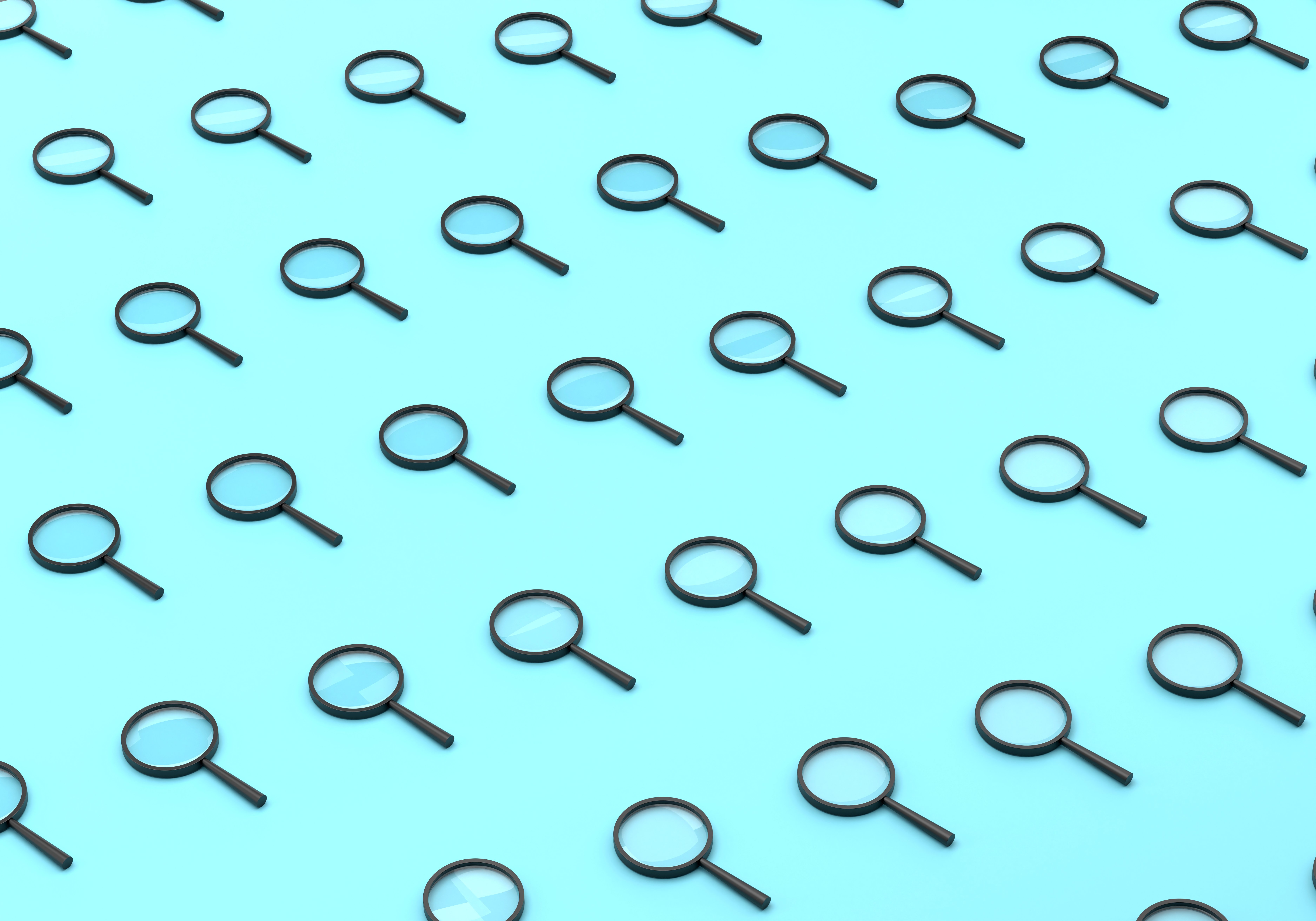 Magnifying glass over digital text representing AI watermark detection technology