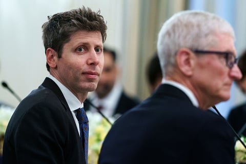 Apple CEO Tim Cook and OpenAI CEO Sam Altman at the White House State Dinner, September 2025, months before Apple filed its trade secrets lawsuit against OpenAI