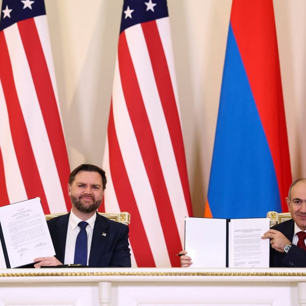 Nikol Pashinyan and JD Vance hold signed copies of the Armenia-US civil nuclear agreement in Yerevan