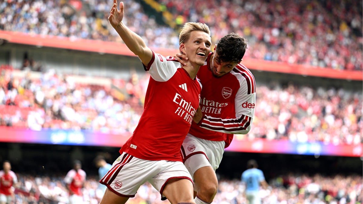 Arsenal players celebrate after defeating Manchester City 3-0 in the Community Shield at Principality Stadium Cardiff