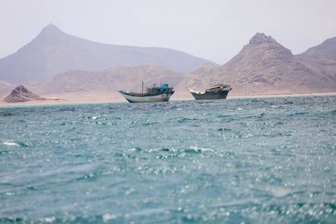 Boats transit the Bab al-Mandeb Strait near Yemen the critical Red Sea shipping chokepoint targeted in the Houthi toll dispute