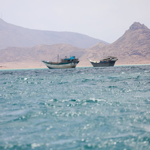 Boats transit the Bab al-Mandeb Strait near Yemen the critical Red Sea shipping chokepoint targeted in the Houthi toll dispute