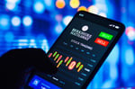 Smartphone displaying Berkshire Hathaway BRK stock price chart on a trading app