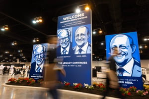 Portraits of Warren Buffett and Greg Abel displayed at Berkshire Hathaway annual shareholders meeting in Omaha, Nebraska, May 2026