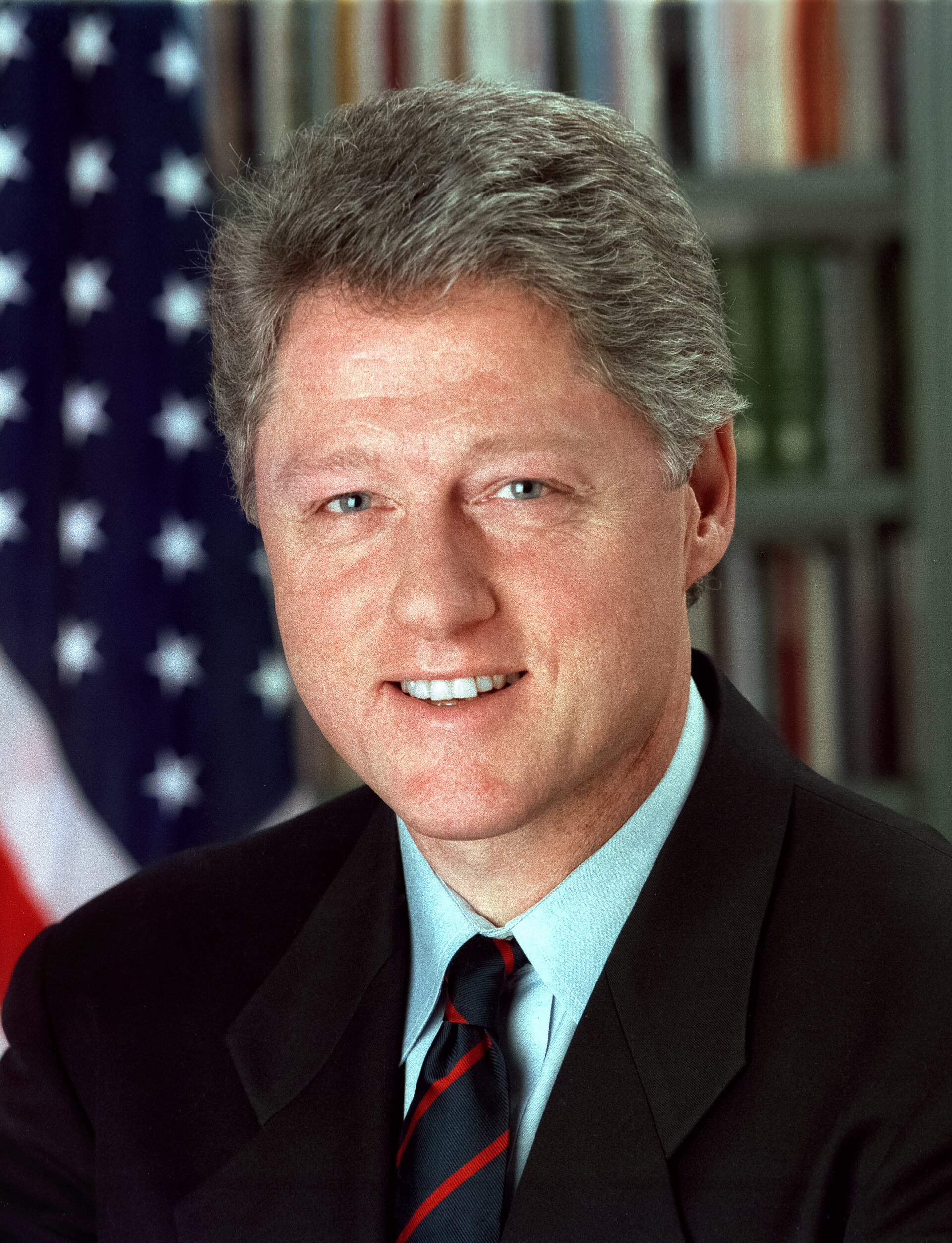 Bill Clinton in a dark suit in his official portrait as the 42nd president of the United States