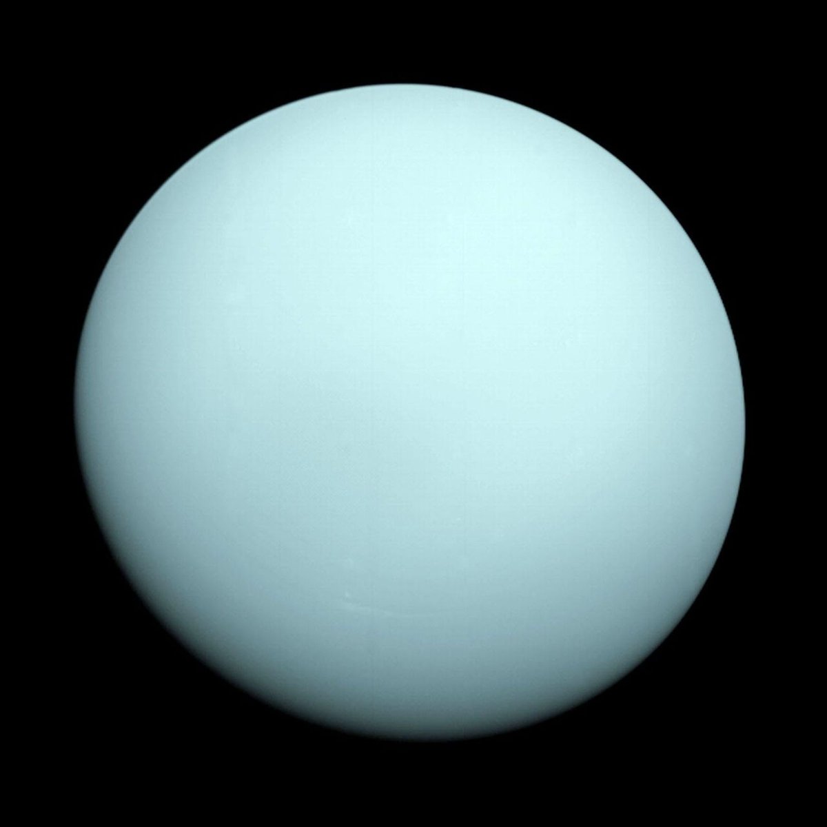 The pale blue-green full disc of Uranus photographed by NASA's Voyager 2 spacecraft in 1986