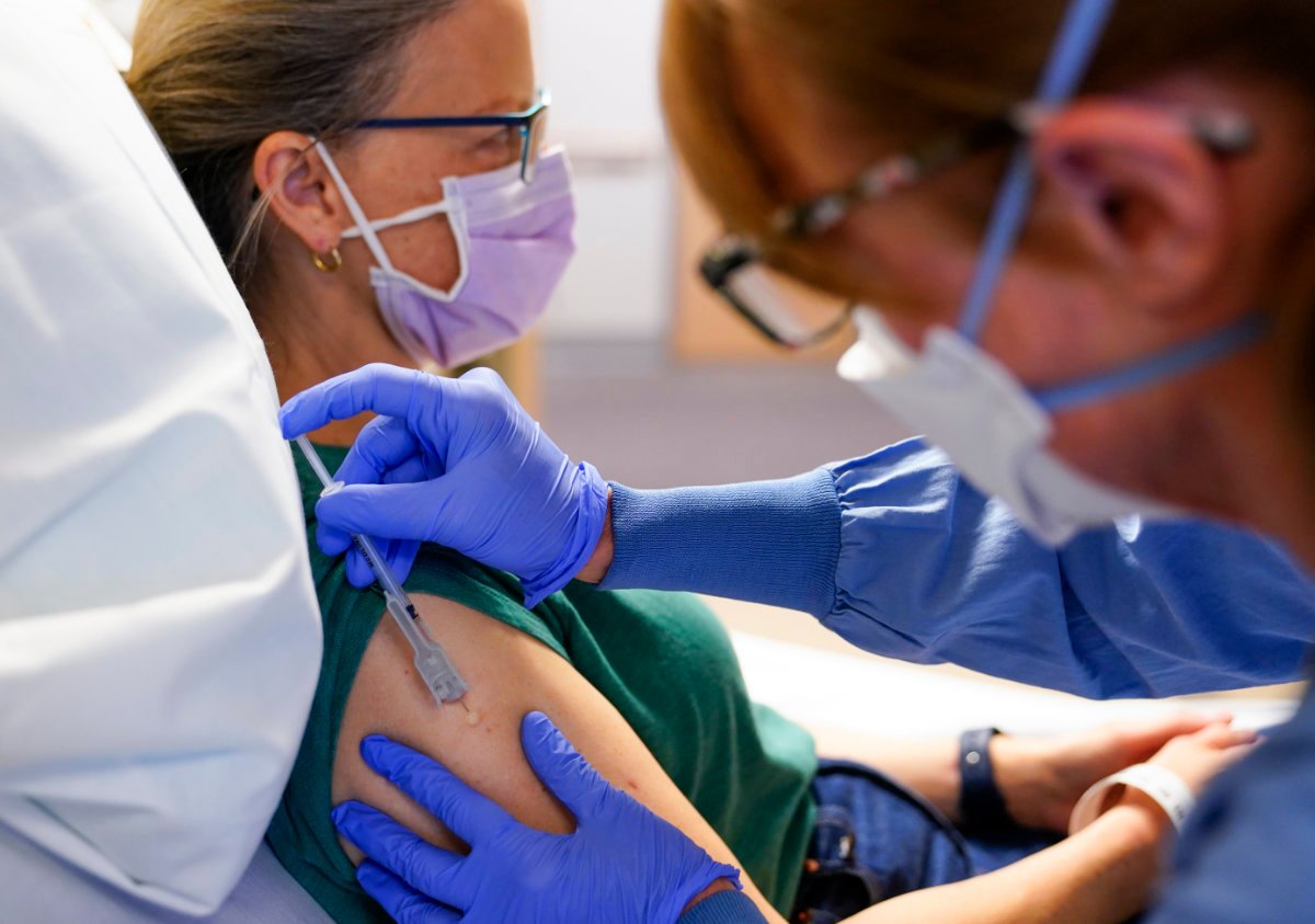 Cancer patient receiving experimental immunotherapy treatment at a medical research center, reflecting advances in oncology drugs like Merck's Keytruda
