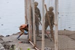 Migrants at Spain-Morocco border crossing in Ceuta during July 2026 mass surge