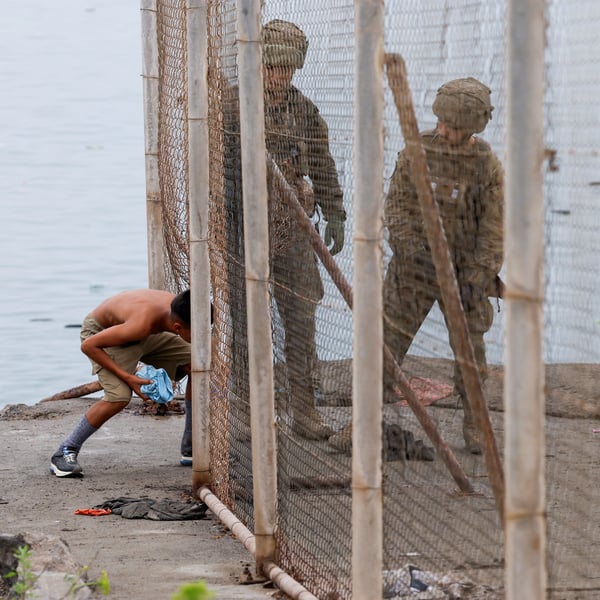 Migrants at Spain-Morocco border crossing in Ceuta during July 2026 mass surge