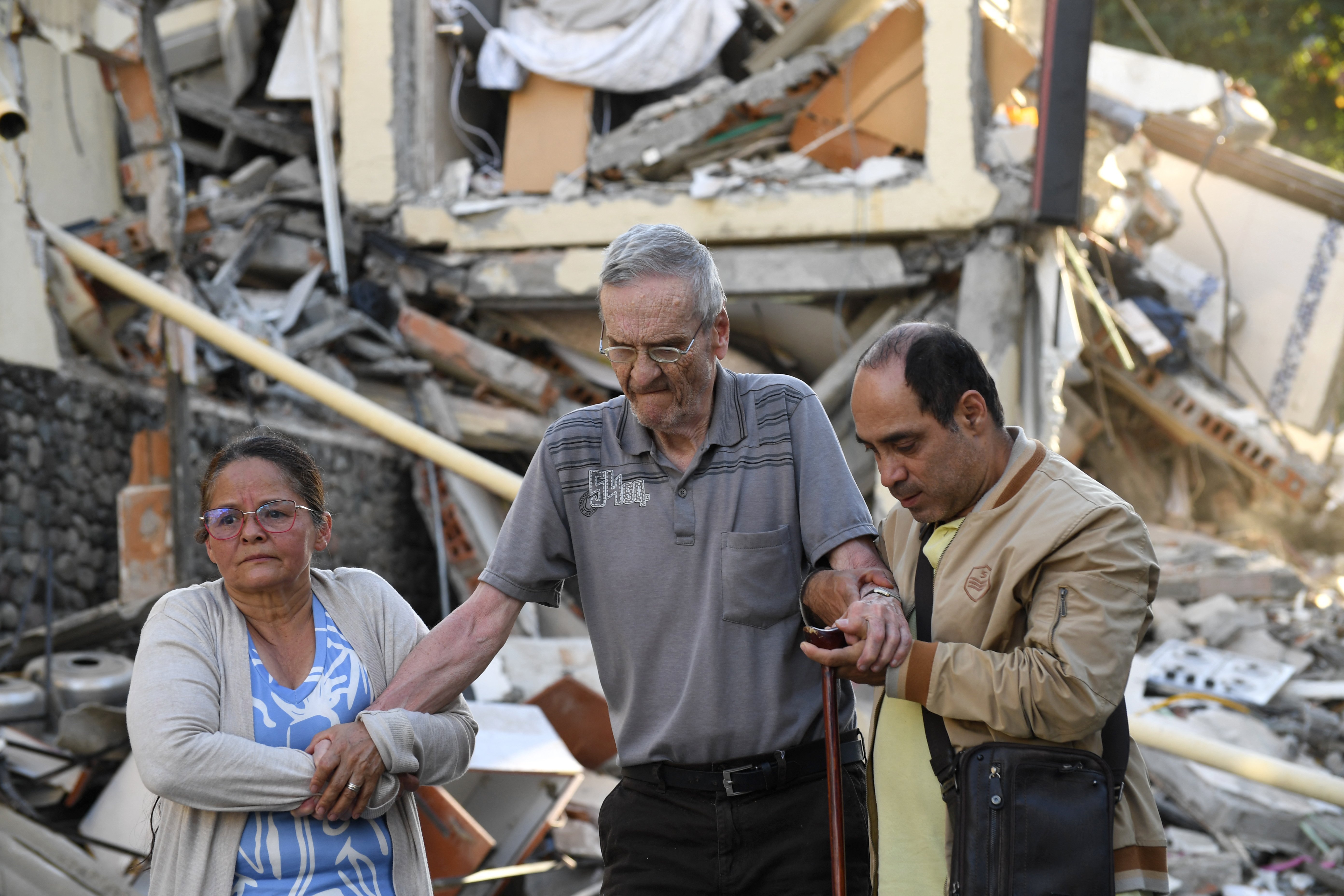 Emergency rescue workers search through debris of a collapsed building in Cali after Colombia earthquake August 2026