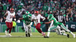 Deebo Samuel running with the ball in Commanders colors during his 2025 season before returning to the San Francisco 49ers