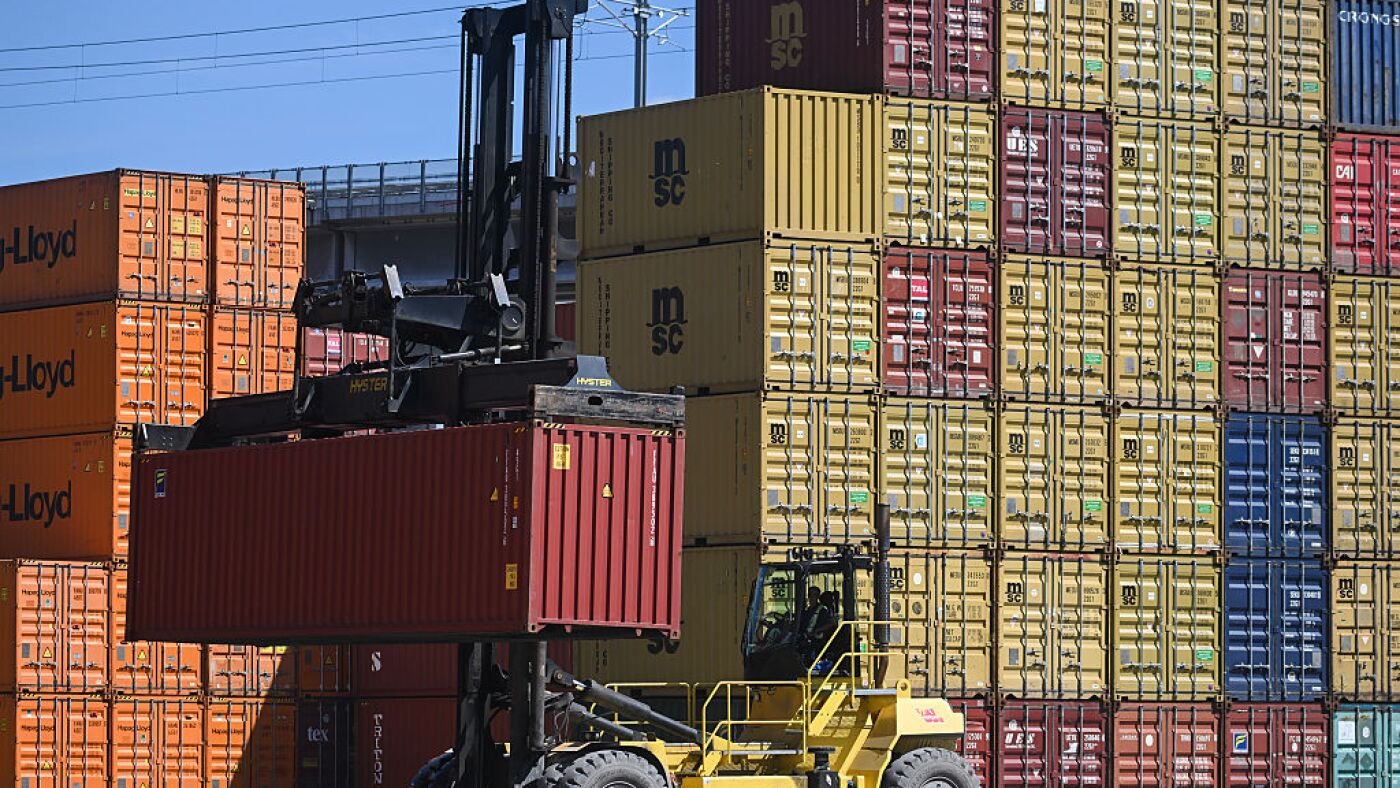 Dow Jones today: a shipping container is moved at a Montreal freight yard as 50 percent US tariffs on Canadian goods take effect