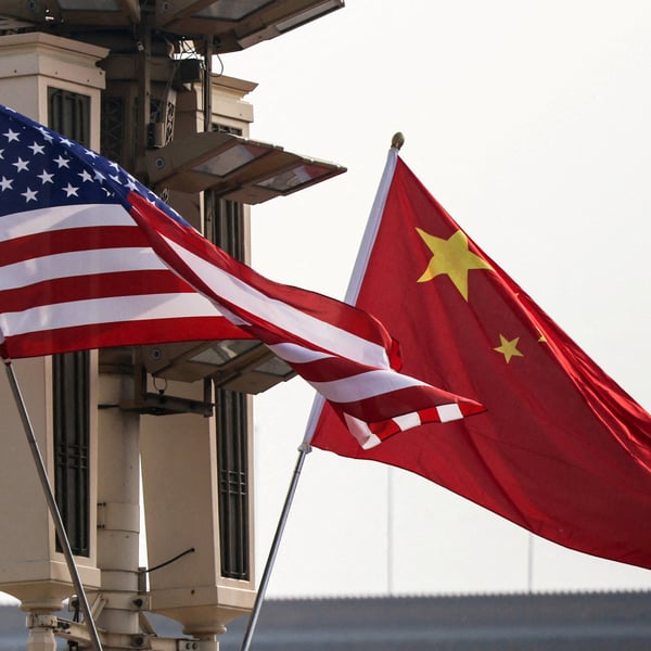 Dow Jones today: United States and Chinese national flags in Beijing as Washington expands sanctions on Iranian oil and Beijing says it will safeguard its own interests