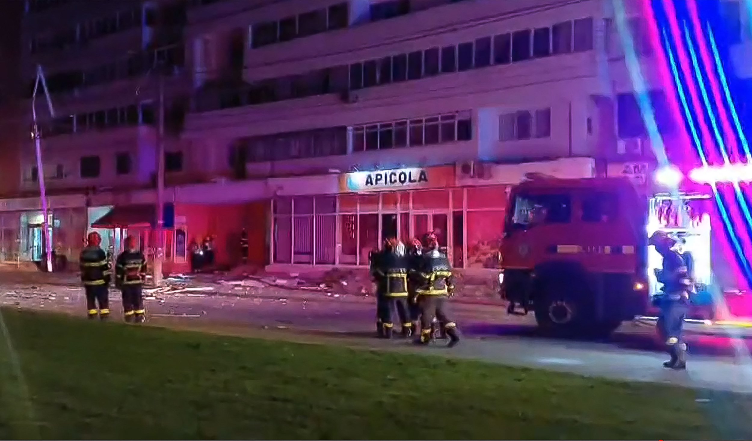 First responders at a residential building in Galati, Romania, after a drone crashed into it