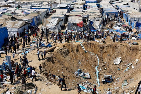 Palestinians inspect overnight Israeli strike on medicine warehouse at Al-Aqsa Martyrs Hospital, Deir el-Balah, Gaza