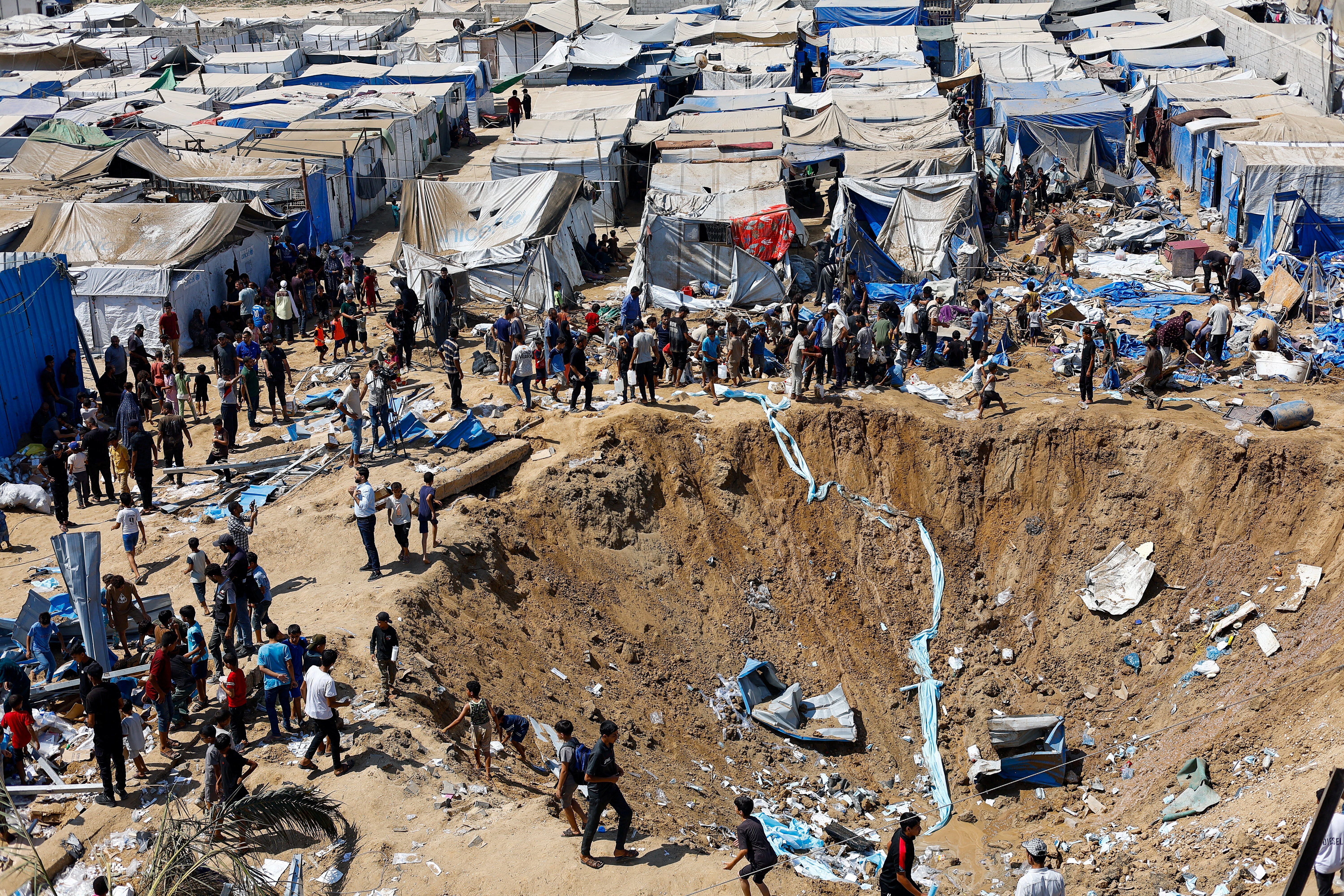Palestinians inspect overnight Israeli strike on medicine warehouse at Al-Aqsa Martyrs Hospital, Deir el-Balah, Gaza